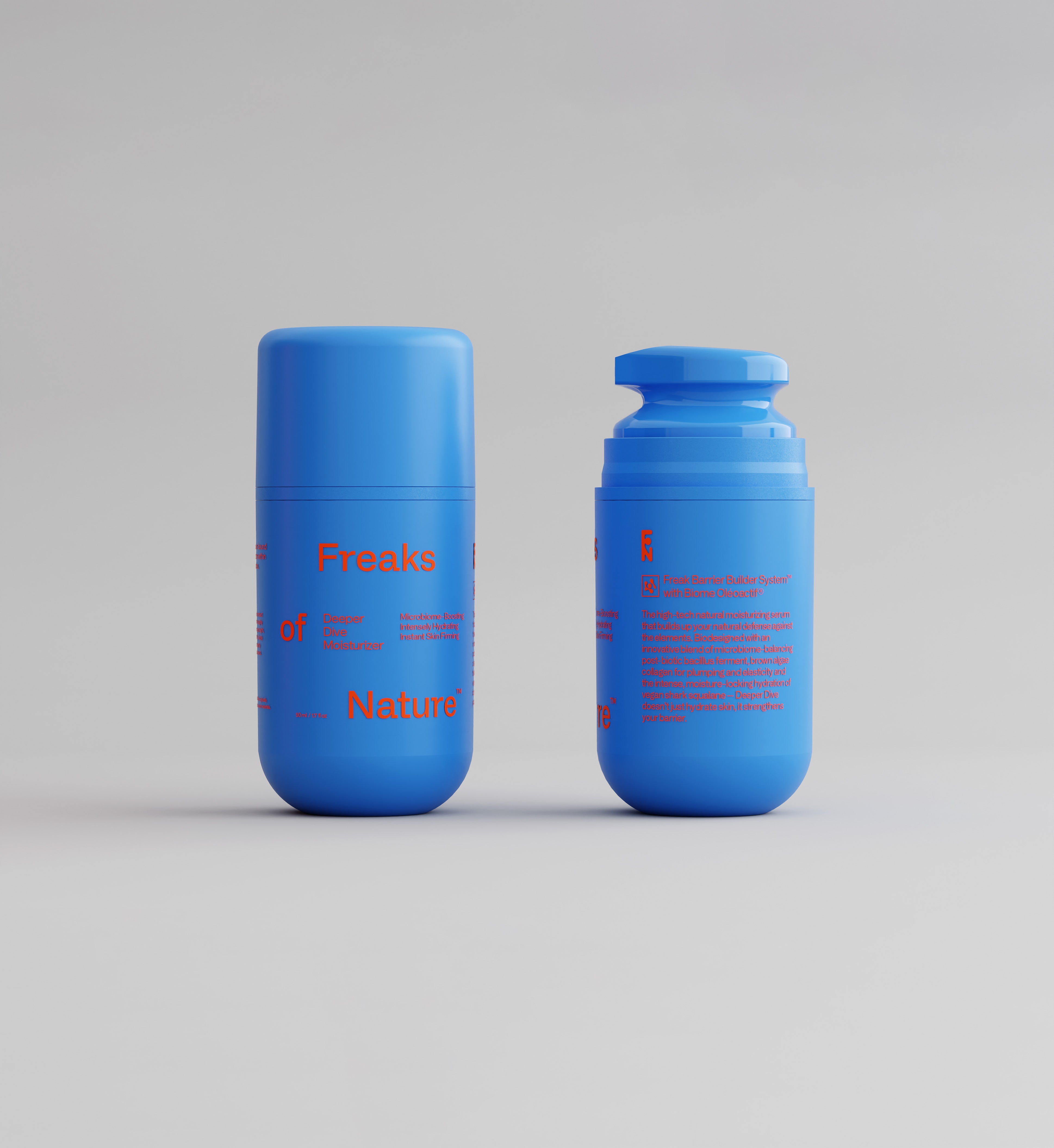 Two blue cylindrical containers with red text on them, positioned against a neutral background. One container has its cap on, while the other has the cap off, revealing a dispensing mechanism. The text reads "Freaks of Nature Skincare" and product details about its Deeper Dive Moisturizer microbiome-balancing moisturizing serum.