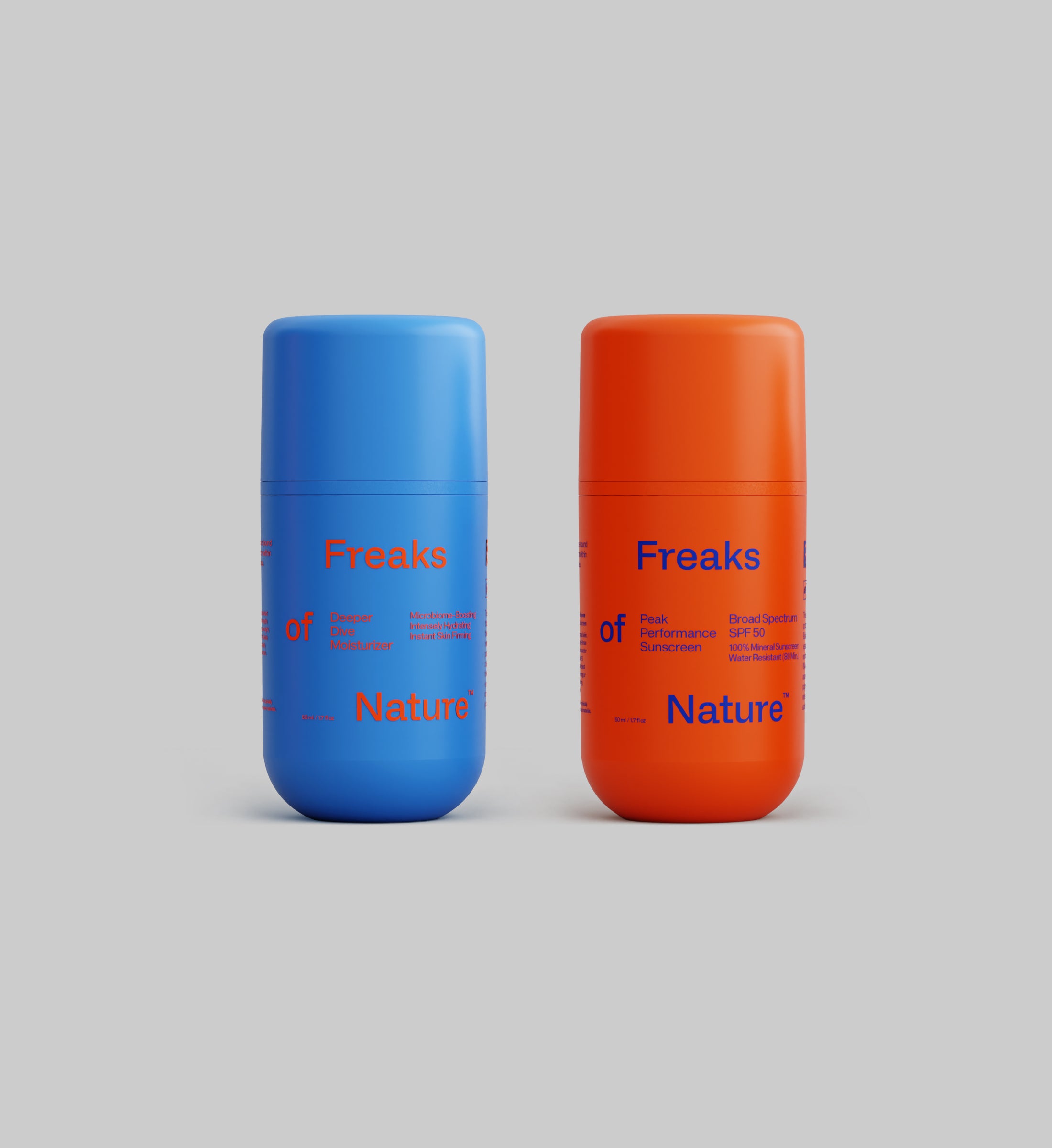 Two cylindrical bottles of sunscreen against a gray background. The blue bottle on the left is labeled "Freaks of Nature Skincare, Endurance System Sunscreen with vegan shark Squalane," and the orange bottle on the right is labeled "Freaks of Nature Skincare, Endurance System SPF50 Sunscreen.